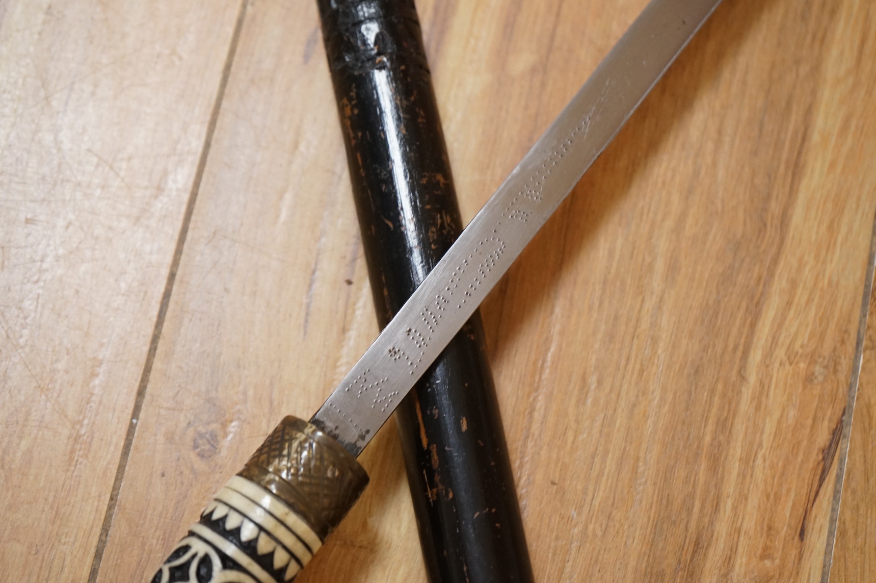 An early 20th century Indonesian sword stick with bone inlay, 92cm in length